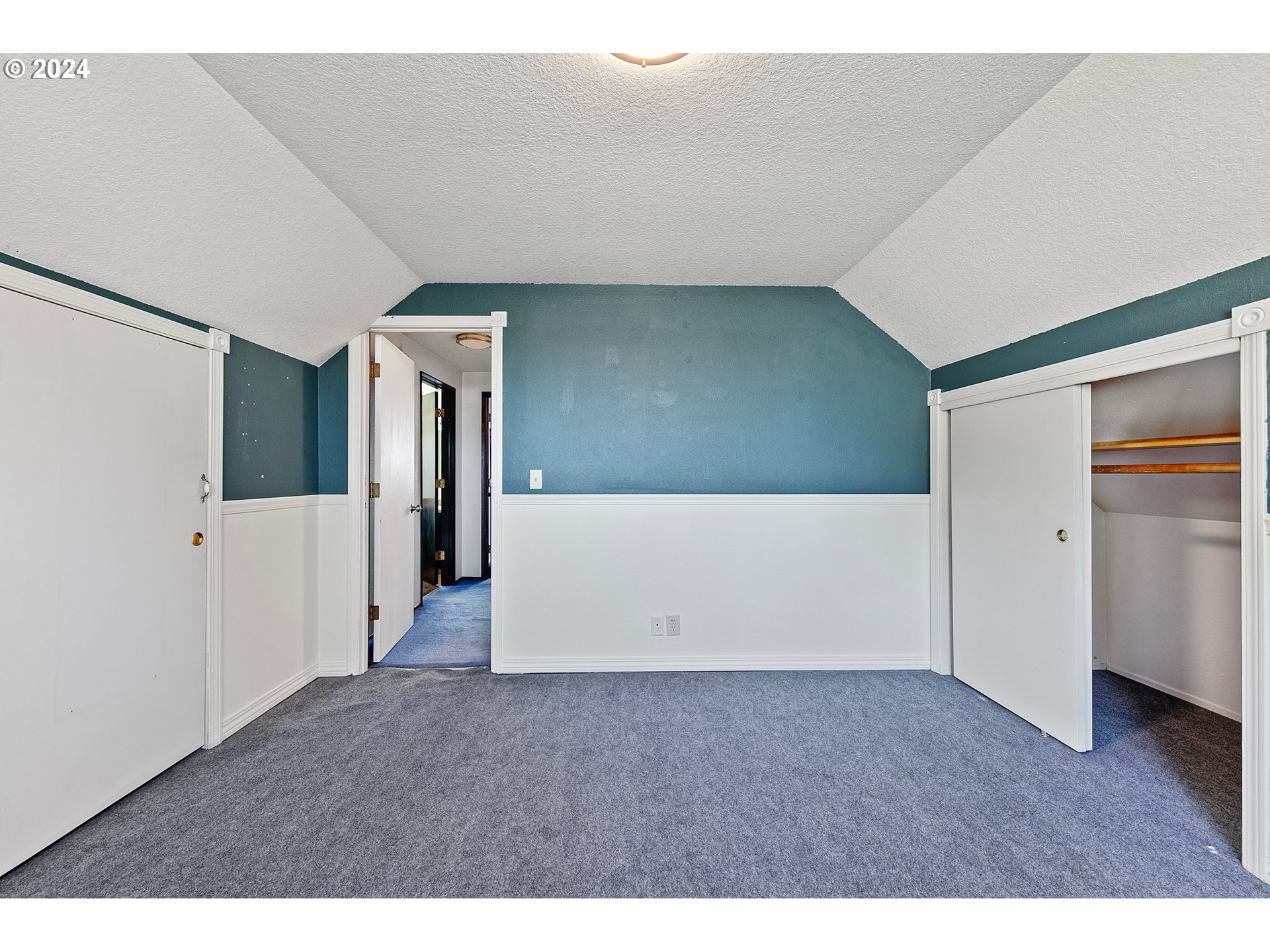4091 Bell Avenue Eugene, OR 97402 - Photo 18 of 29 a view of a big room with wooden floor and stairs