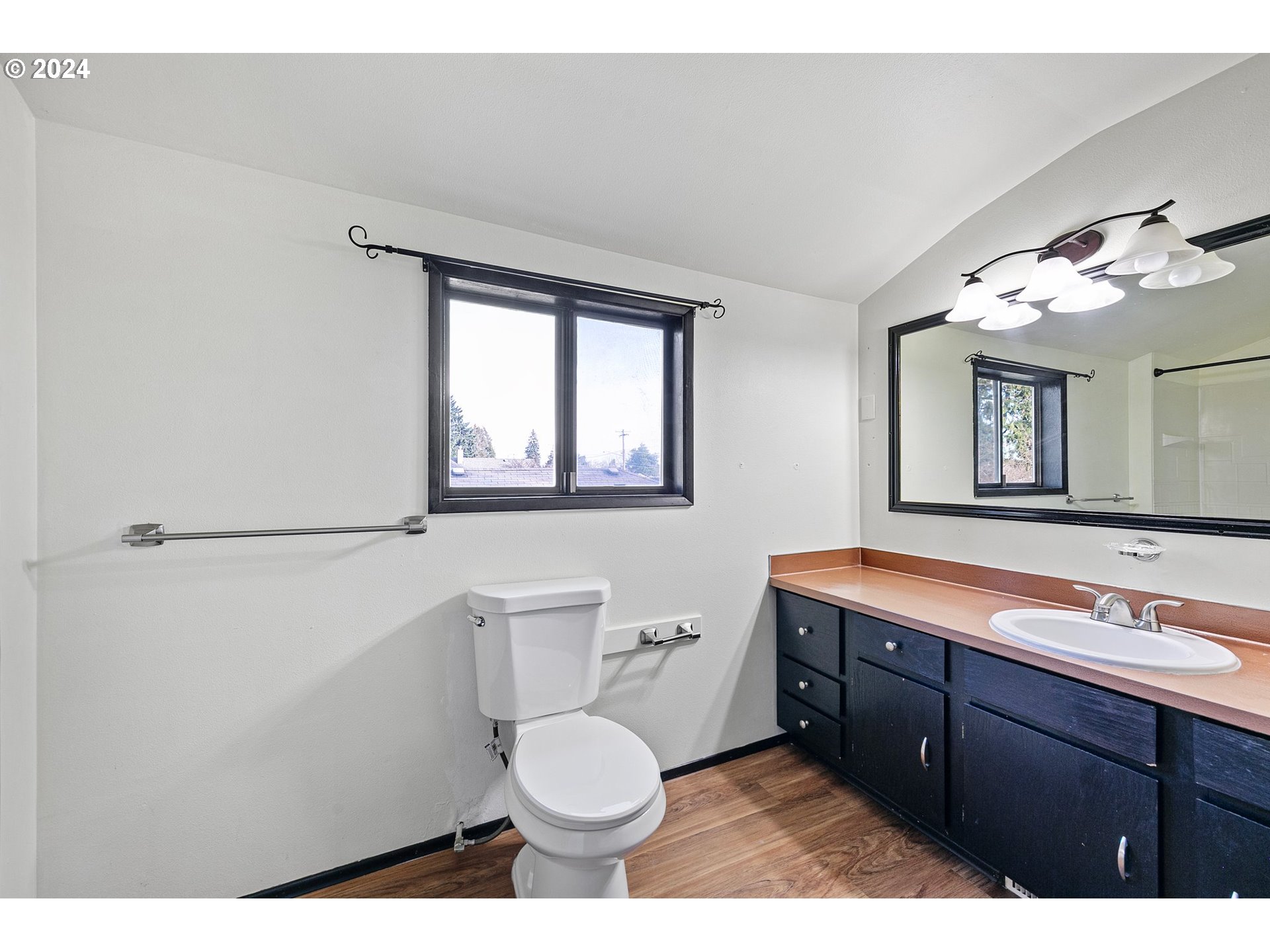 4091 Bell Avenue Eugene, OR 97402 - Photo 20 of 29 a bathroom with a toilet a sink and mirror
