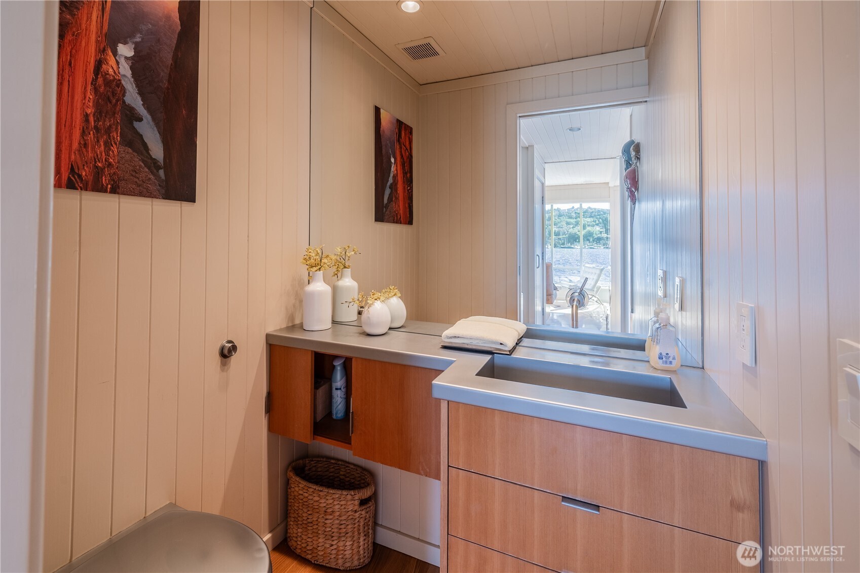 2017 Fairview Avenue East, Unit I Seattle, WA 98102 - Photo 18 of 34 a bathroom with a sink and a mirror