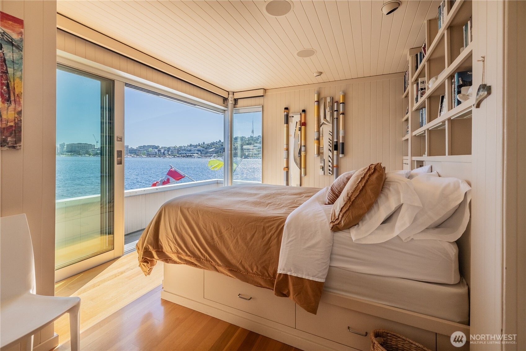 2017 Fairview Avenue East, Unit I Seattle, WA 98102 - Photo 21 of 34 a bed sitting in a bedroom next to a window