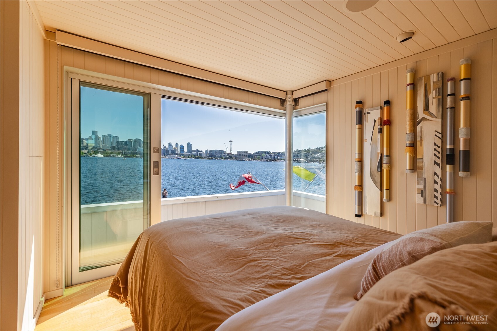 2017 Fairview Avenue East, Unit I Seattle, WA 98102 - Photo 23 of 34 a bed sitting in a bedroom next to a window