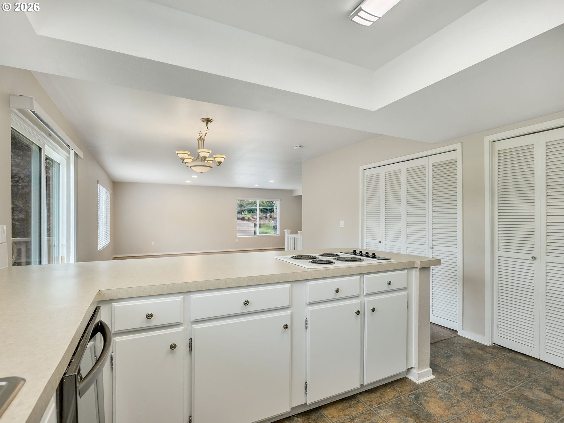 91923 Ridge Road Warrenton, OR 97146 - Photo 13 of 35 a view with cabinets a sink and dishwasher with wooden floor