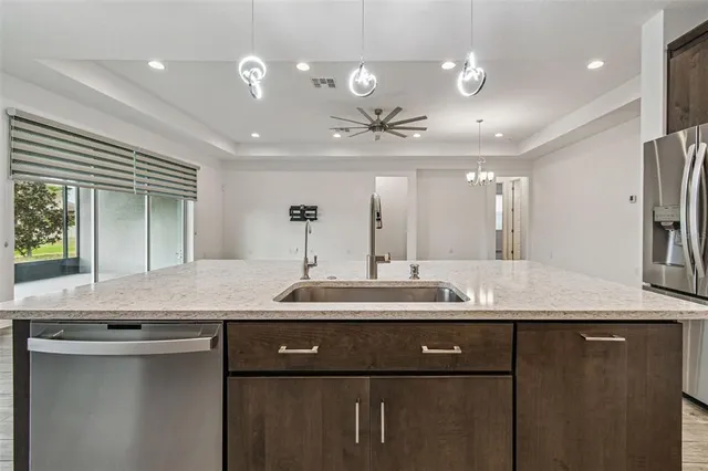 a bathroom with a granite countertop sink a large mirror and vanity