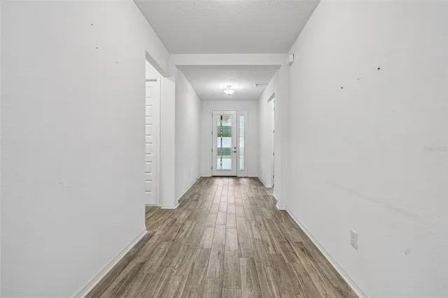 a view of gallery with wooden floor