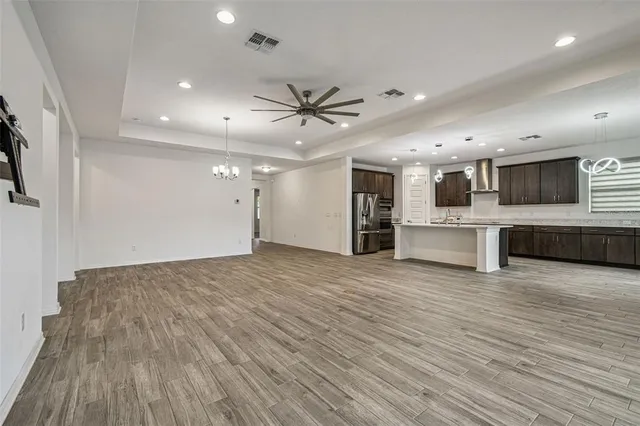 a view of a kitchen with a sink and a stove top oven