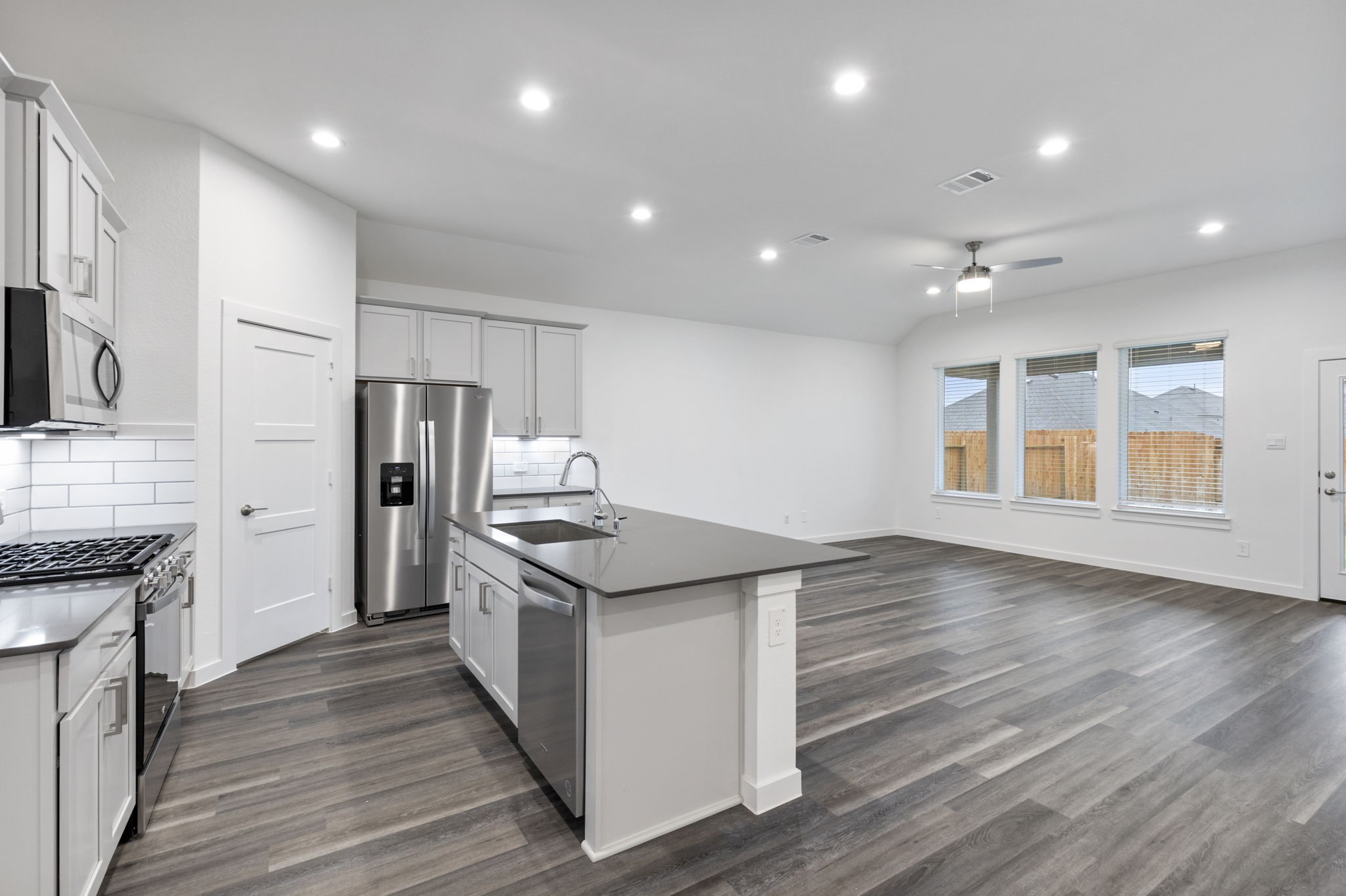 1589 Oakdale Crest Road Montgomery, TX 77316 - Photo 6 of 33 Great, open floor concept from Kitchen to Family Room. LVP flooring throughout.