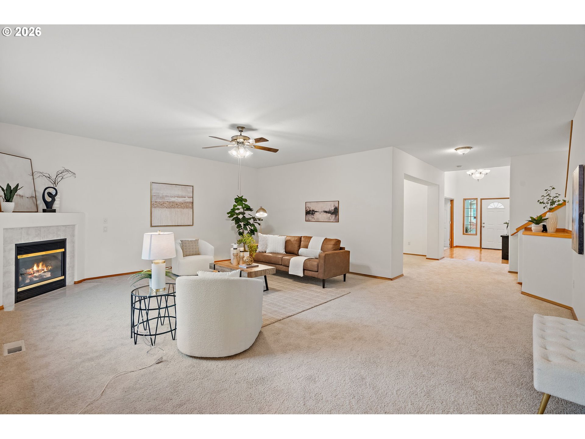 15460 Southwest 145th Terrace Tigard, OR 97224 - Photo 16 of 45 a living room with furniture and a fireplace
