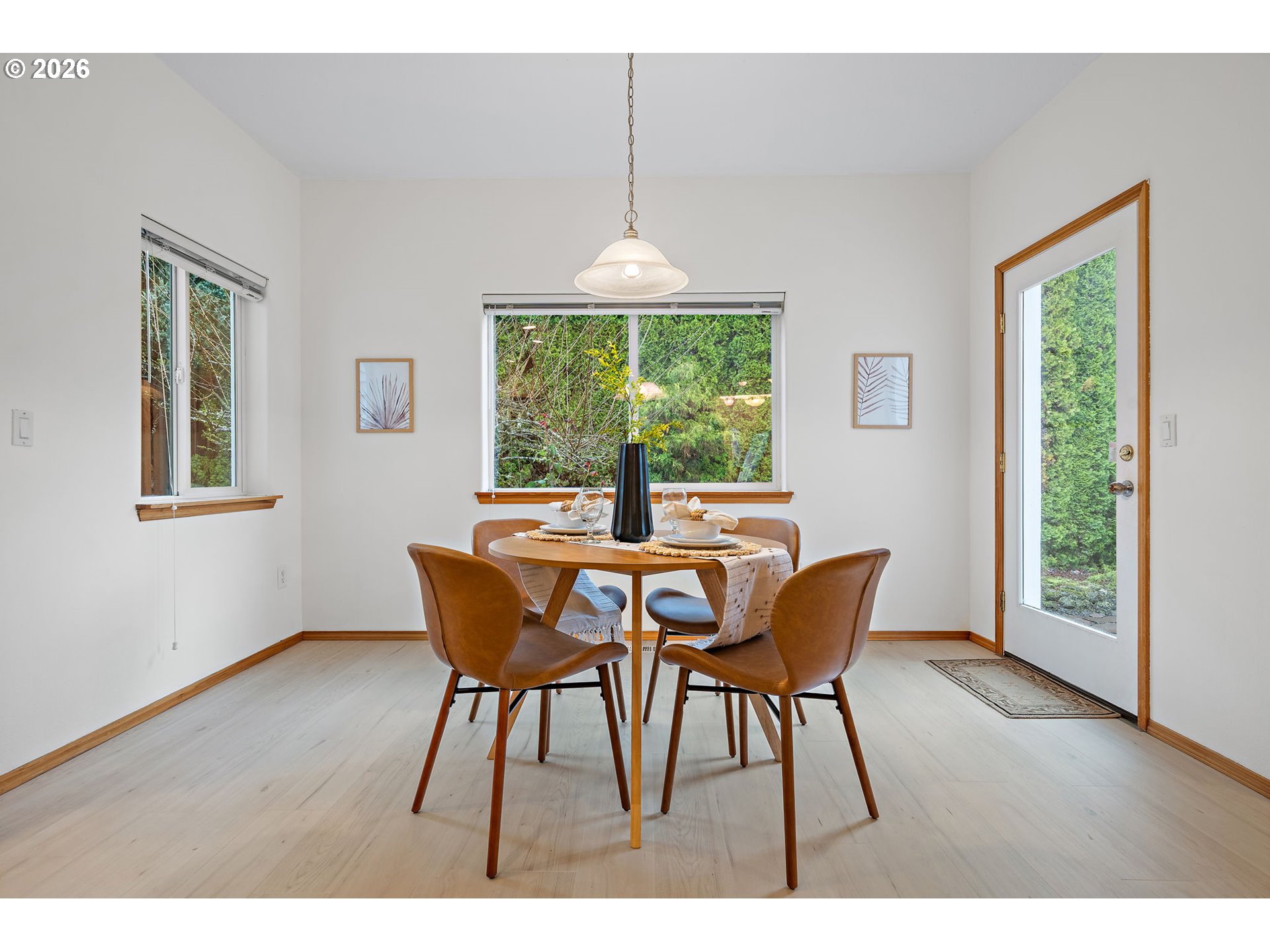 15460 Southwest 145th Terrace Tigard, OR 97224 - Photo 19 of 45 a dining room with furniture a chandelier and wooden floor