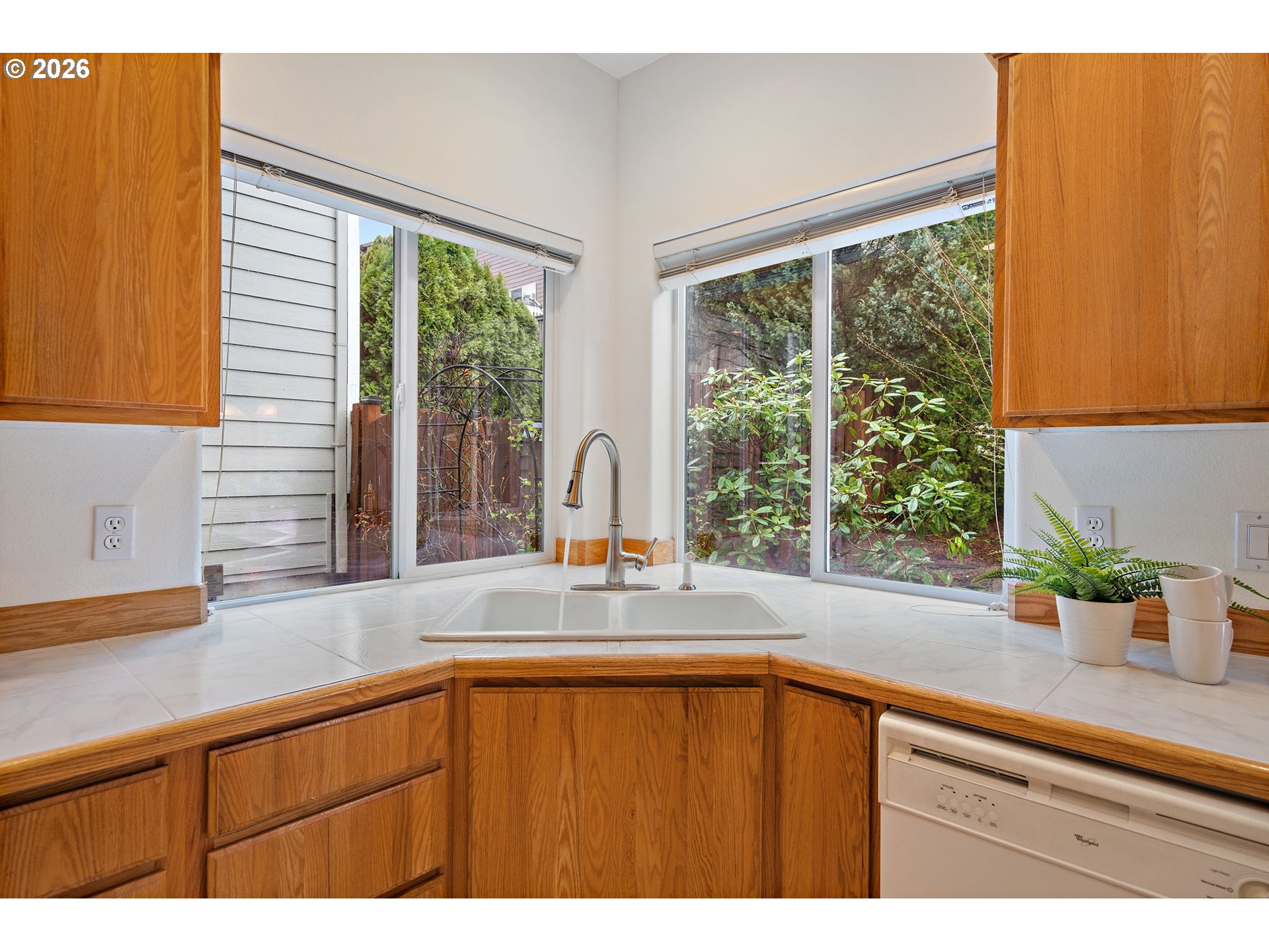 15460 Southwest 145th Terrace Tigard, OR 97224 - Photo 22 of 45 a kitchen with a sink and large window