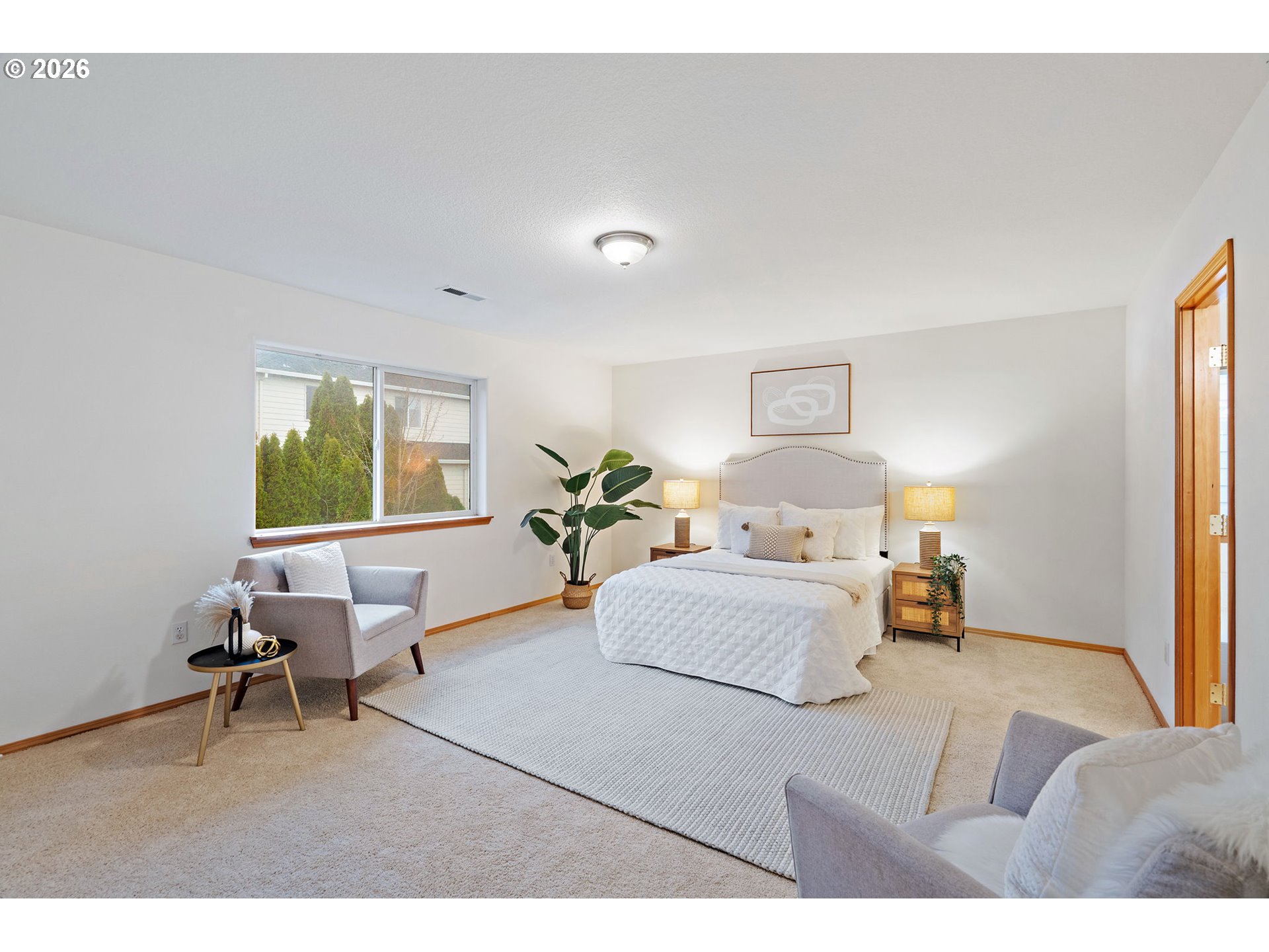 15460 Southwest 145th Terrace Tigard, OR 97224 - Photo 28 of 45 a bed room with a bed window and a chair