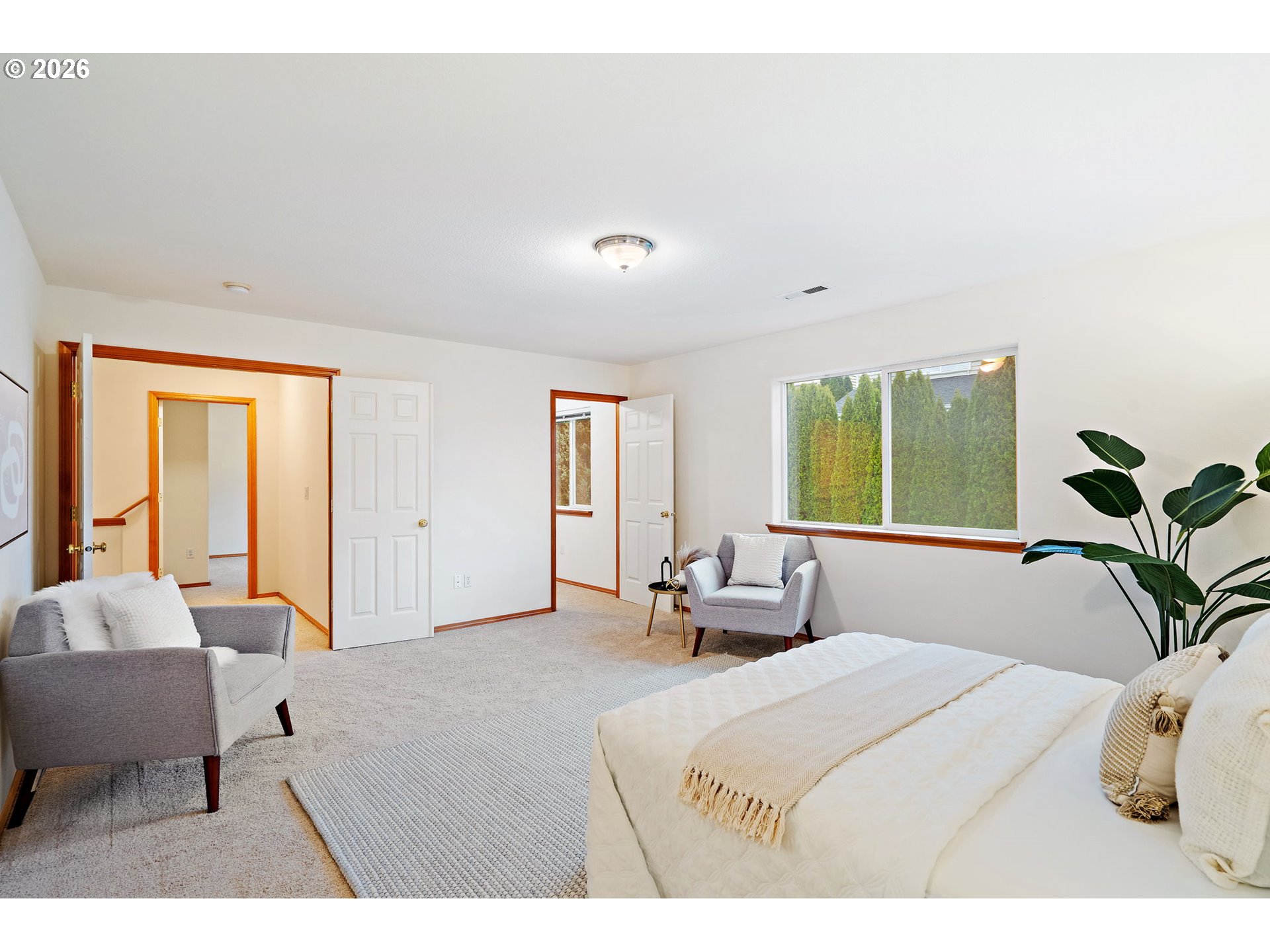 15460 Southwest 145th Terrace Tigard, OR 97224 - Photo 29 of 45 a bedroom with a bed and a large window