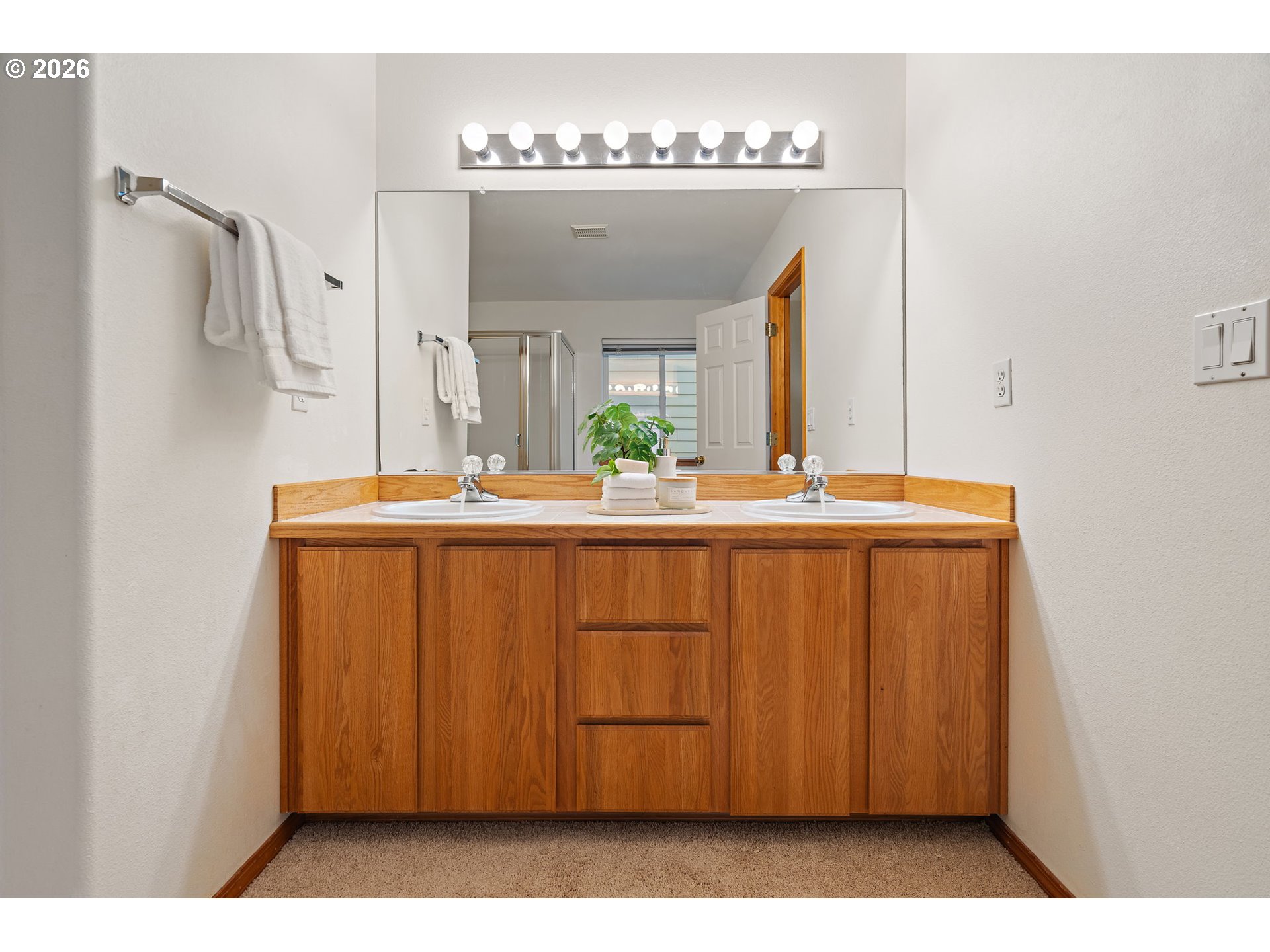 15460 Southwest 145th Terrace Tigard, OR 97224 - Photo 32 of 45 a bathroom with a sink and a mirror