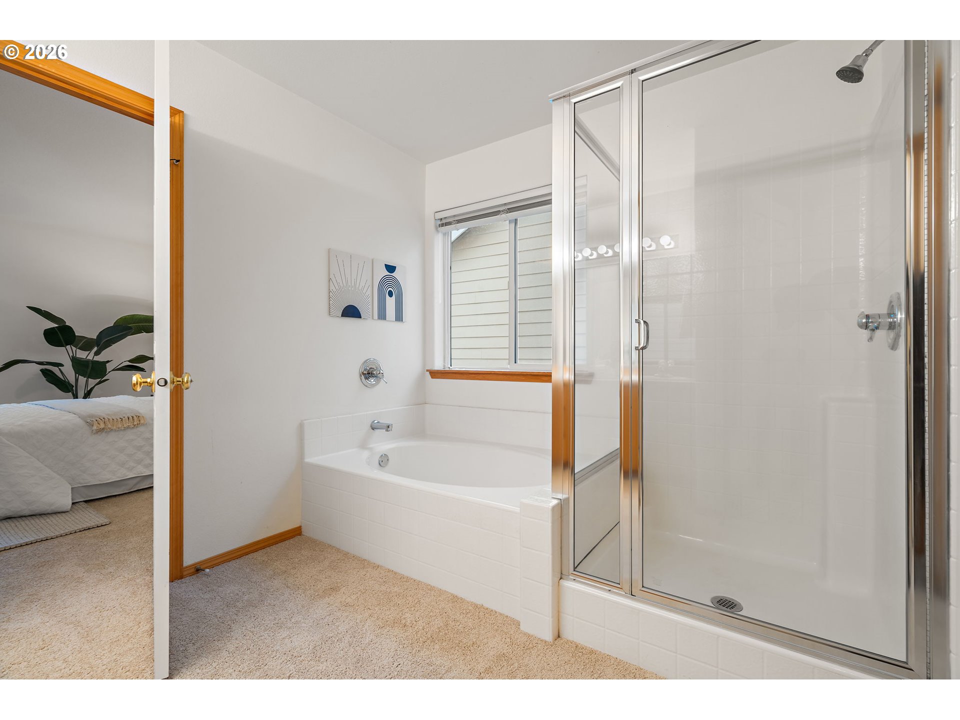 15460 Southwest 145th Terrace Tigard, OR 97224 - Photo 35 of 45 a bathroom with a bathtub and a shower