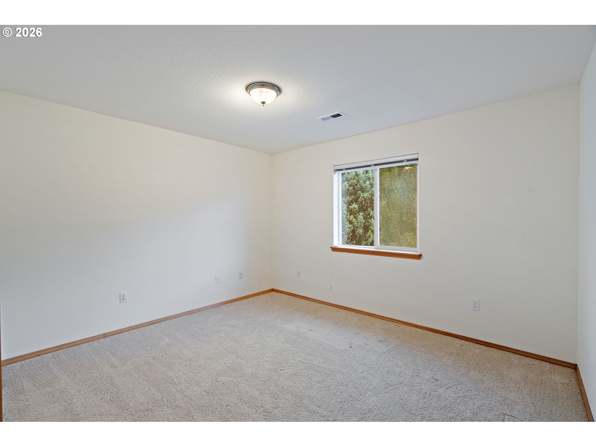 15460 Southwest 145th Terrace Tigard, OR 97224 - Photo 37 of 45 an empty room with windows