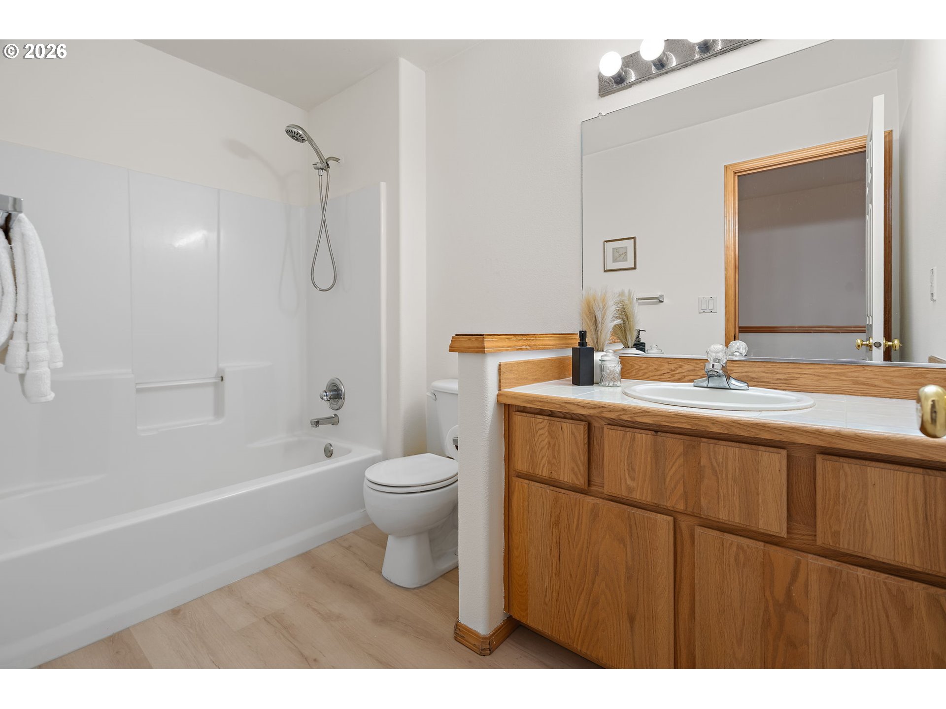 15460 Southwest 145th Terrace Tigard, OR 97224 - Photo 39 of 45 a bathroom with a sink a toilet and shower