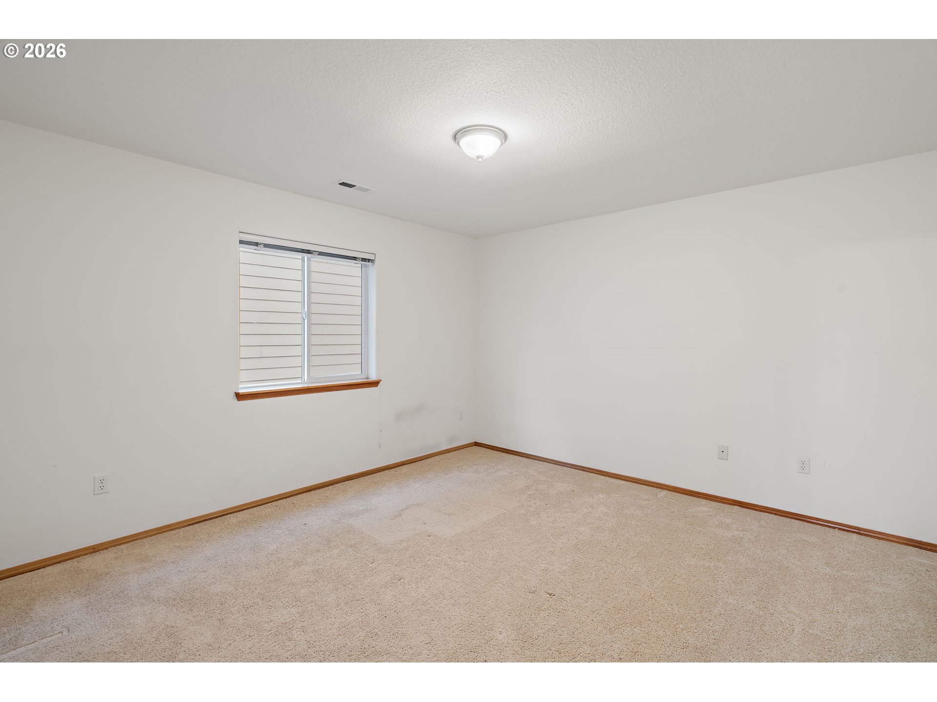 15460 Southwest 145th Terrace Tigard, OR 97224 - Photo 42 of 45 an empty room with windows