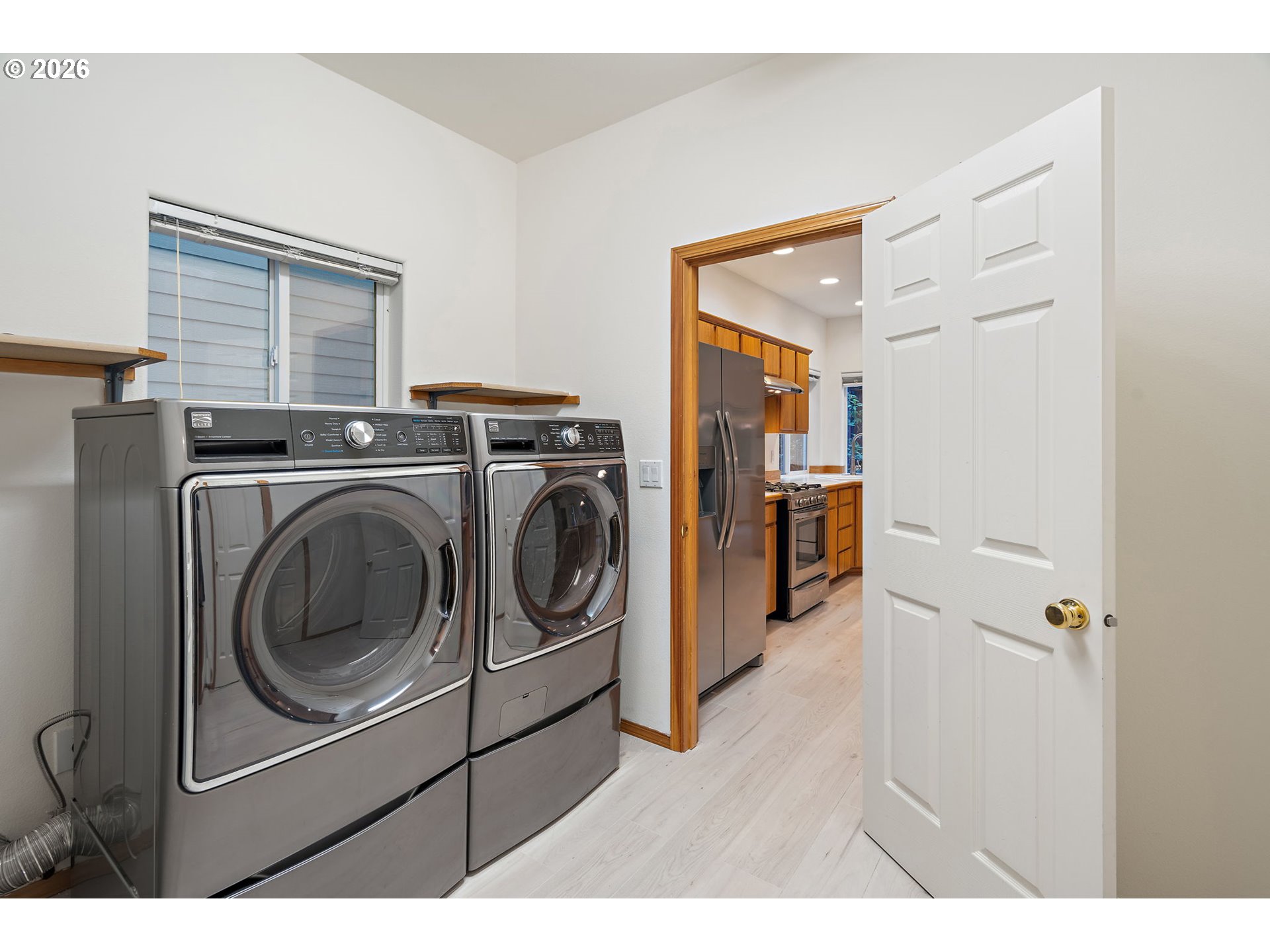 15460 Southwest 145th Terrace Tigard, OR 97224 - Photo 44 of 45 a utility room with dryer and washer