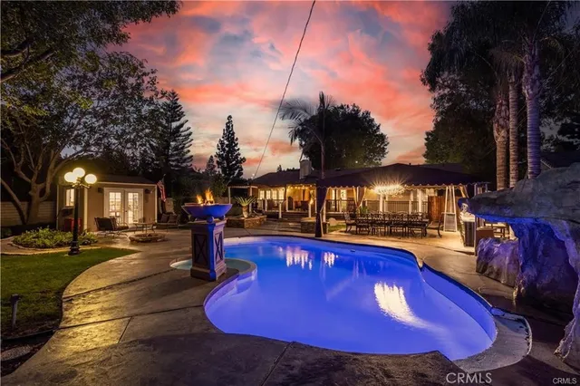 a view of a swimming pool with an outdoor seating