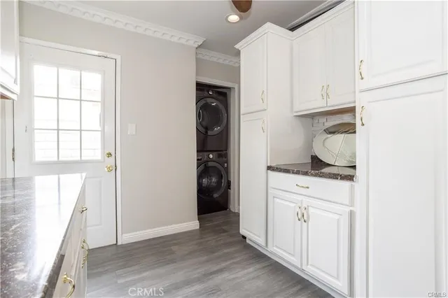 a kitchen with a refrigerator and window