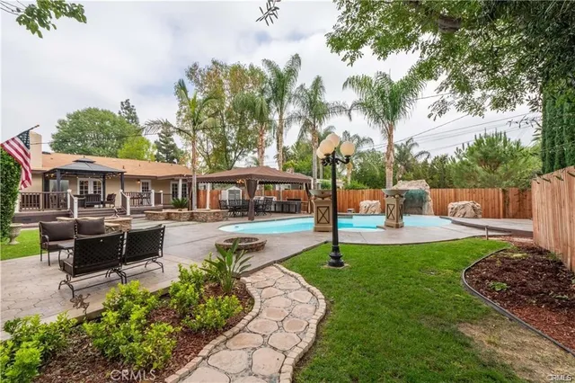 a view of a house with a yard porch and sitting area