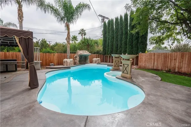 a view of a swimming pool with a patio