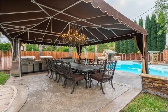 a patio with a table and chairs
