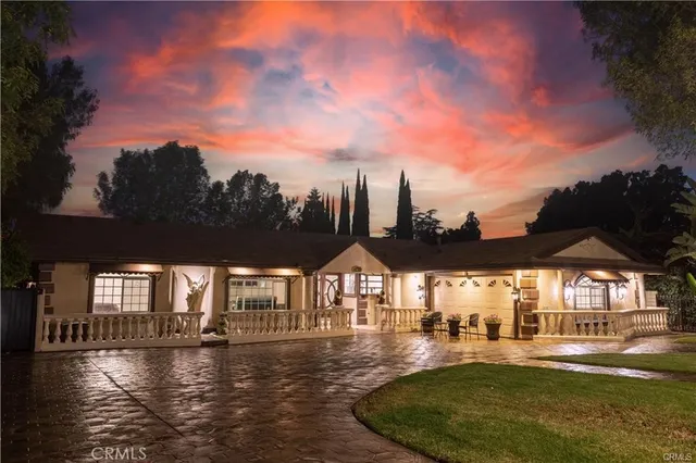 a view of a swimming pool with an outdoor space and seating area