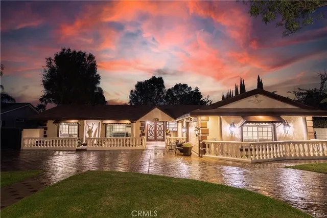 a view of pool with outside seating area