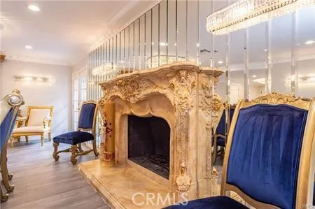 a view of living room with furniture and a fireplace