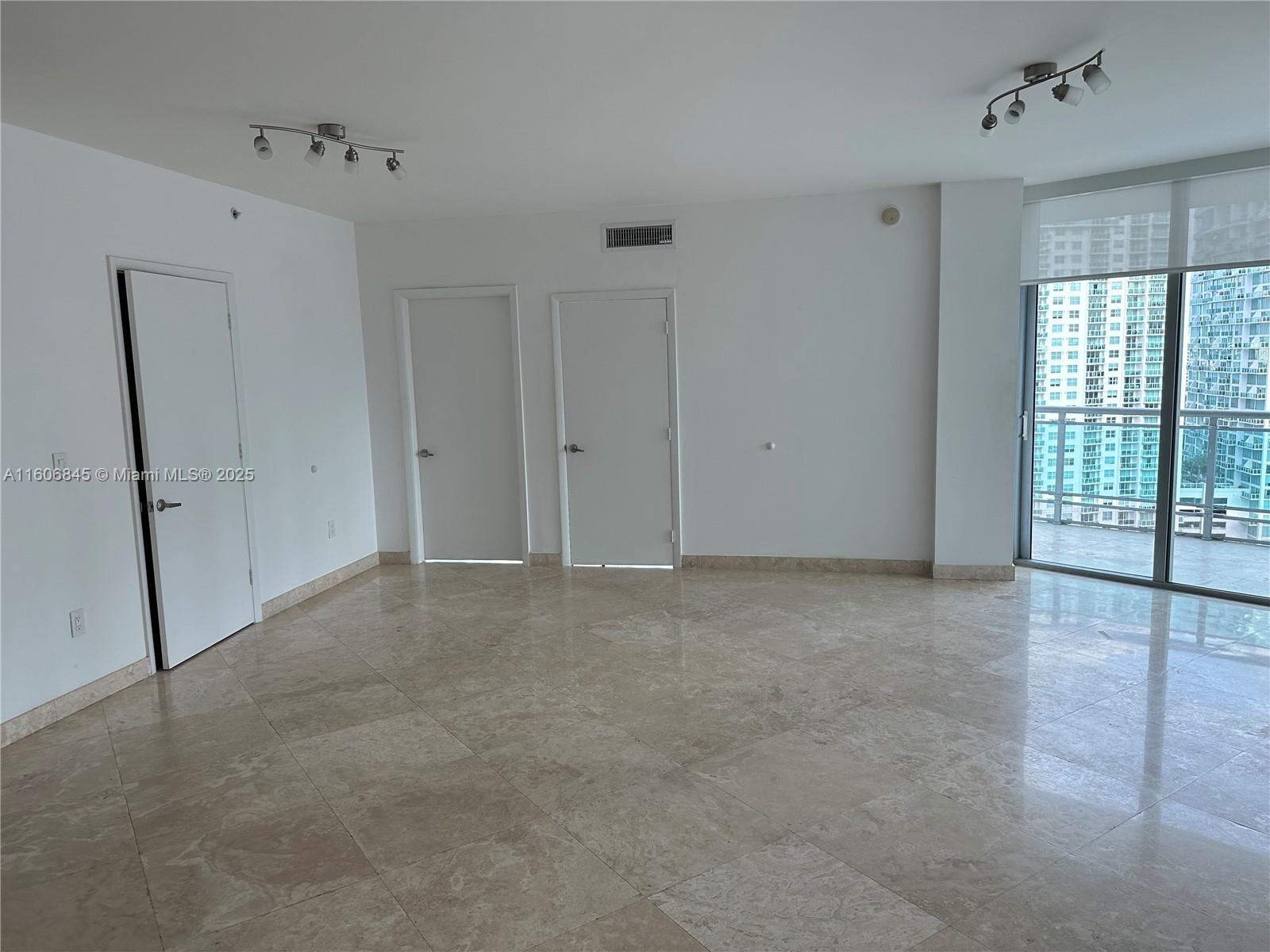 350 South Miami Avenue, Unit 2302 Miami, FL 33130 - Photo 1 of 32 a view of an empty room with a window