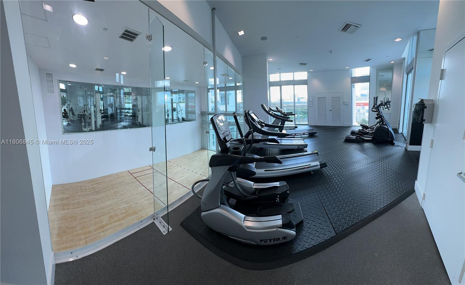 350 South Miami Avenue, Unit 2302 Miami, FL 33130 - Photo 12 of 32 a room with lots of chairs and mirrors