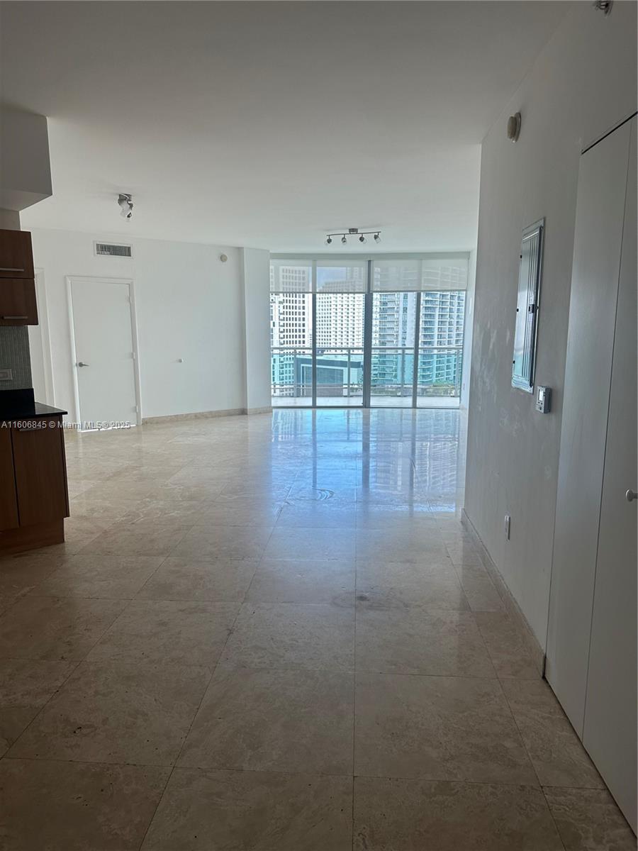 350 South Miami Avenue, Unit 2302 Miami, FL 33130 - Photo 18 of 32 a view of an empty room with glass door