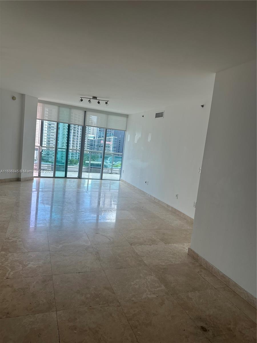 350 South Miami Avenue, Unit 2302 Miami, FL 33130 - Photo 23 of 32 a view of an empty room with a window