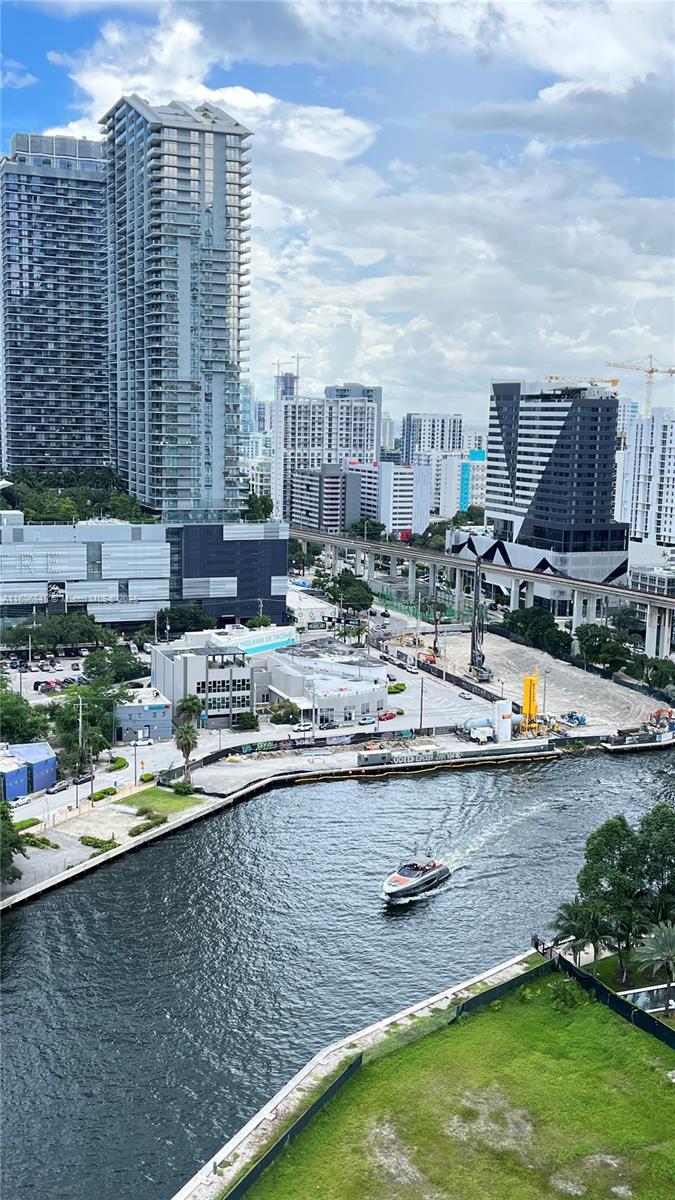 350 South Miami Avenue, Unit 2302 Miami, FL 33130 - Photo 28 of 32 a view of a lake with a big yard and large buildings