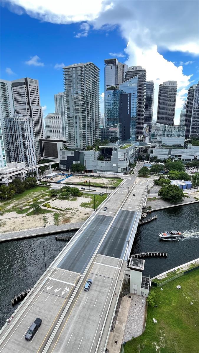 350 South Miami Avenue, Unit 2302 Miami, FL 33130 - Photo 30 of 32 a view of a swimming pool with outdoor seating
