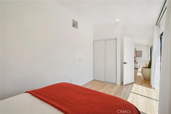 a bedroom with a bed and a view of bathroom