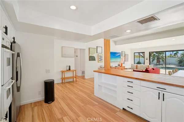 a kitchen with a sink and refrigerator