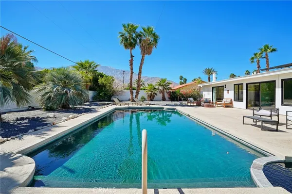 a view of a patio with swimming pool