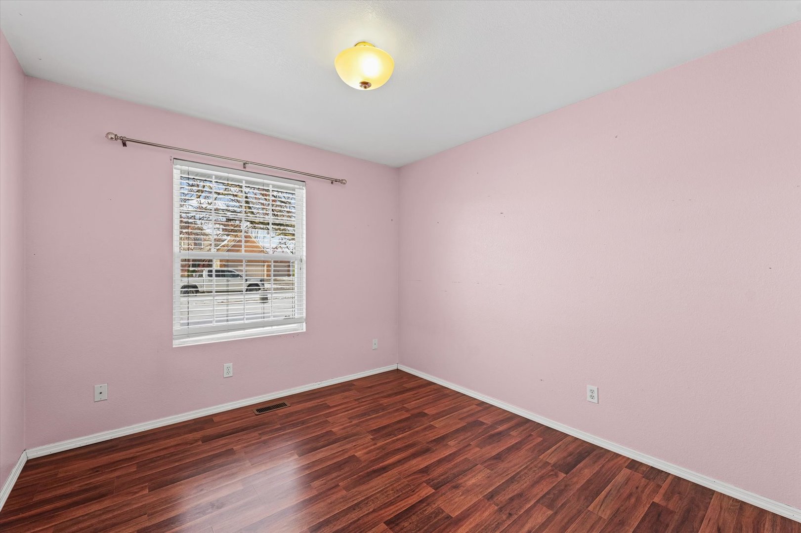606 Cedar Drive St. Joseph, IL 61873 - Photo 19 of 32 an empty room with wooden floor and windows