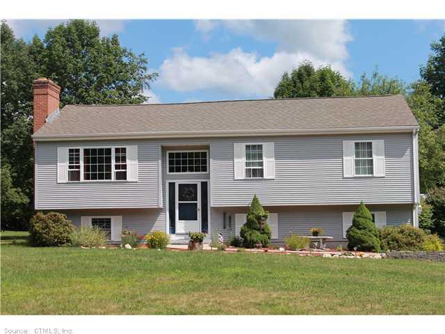 374 Jurach Road Colchester, CT 06415 - Photo 1 of 1 a front view of a house with a garden