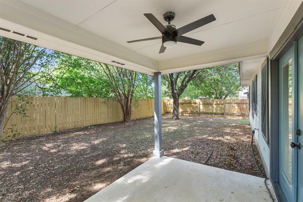 617 Barbara Way Bastrop, TX 78602 - Photo 16 of 20 An inviting covered patio offers a cool retreat overlooking a spacious, fenced private yard.