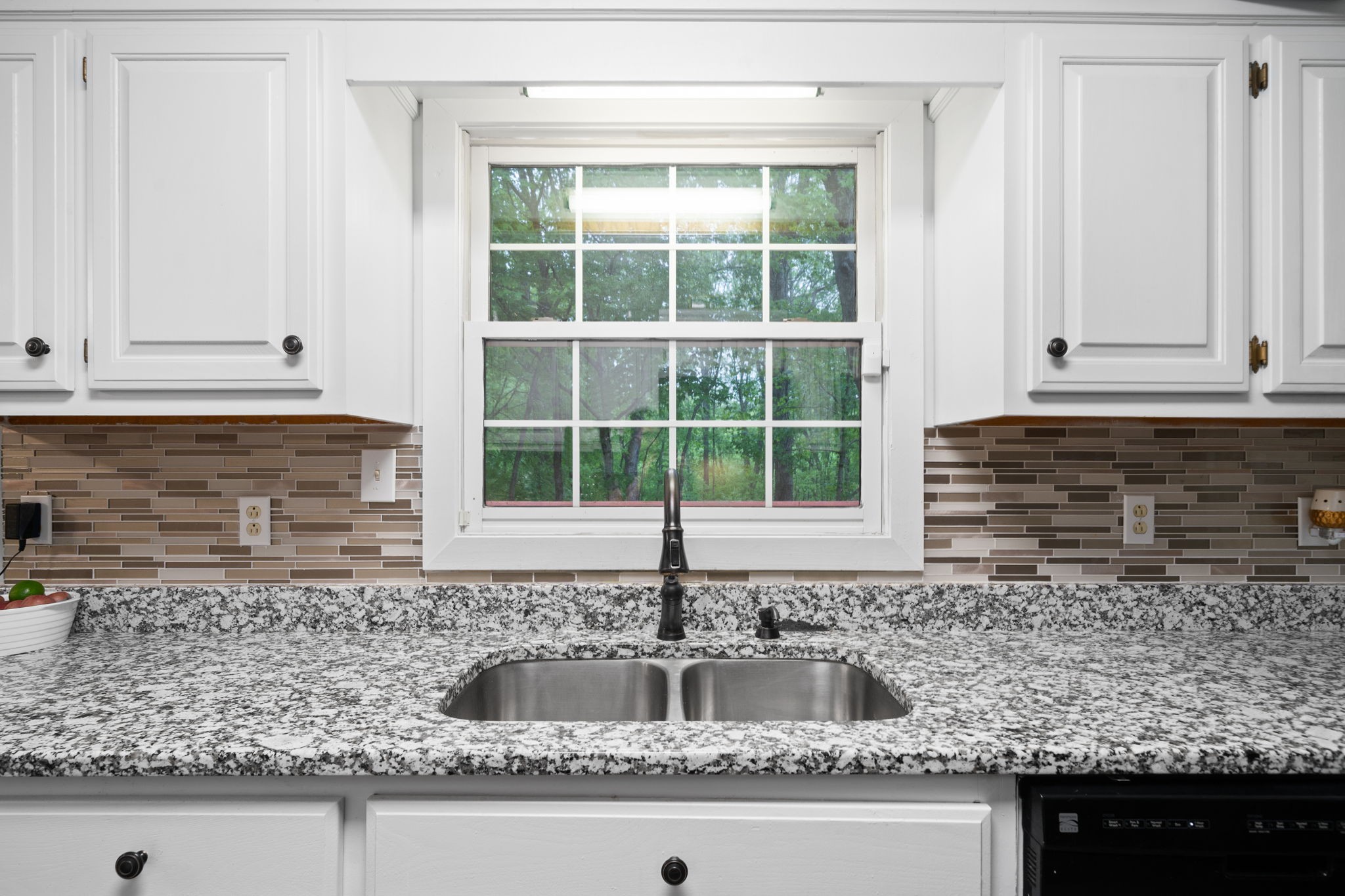 1925 7 Mile Ferry Road Clarksville, TN 37040 - Photo 20 of 57 a kitchen with granite countertop a sink and white cabinets
