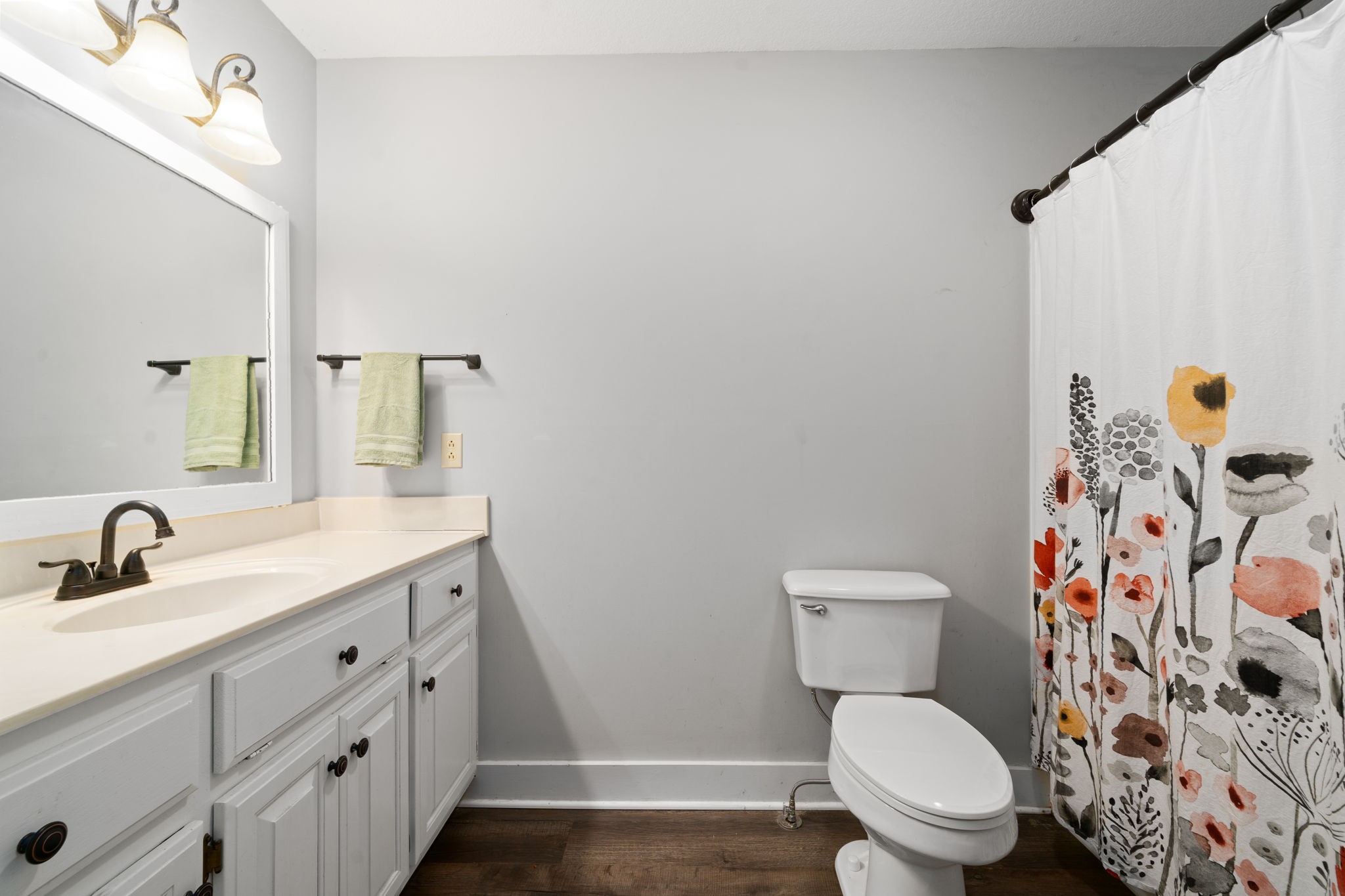 1925 7 Mile Ferry Road Clarksville, TN 37040 - Photo 28 of 57 a bathroom with a toilet sink and mirror