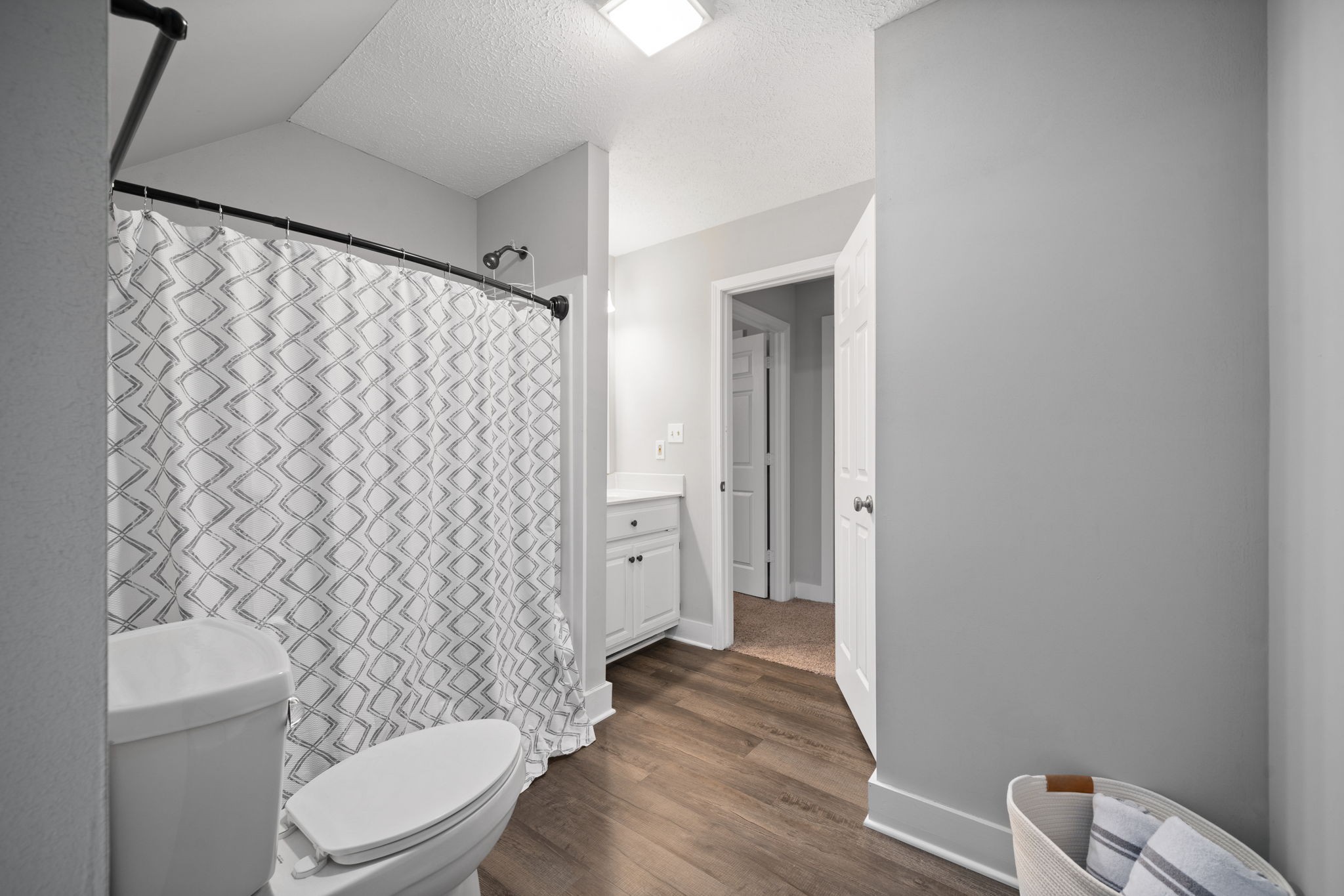 1925 7 Mile Ferry Road Clarksville, TN 37040 - Photo 34 of 57 a bathroom with a toilet and a shower curtain