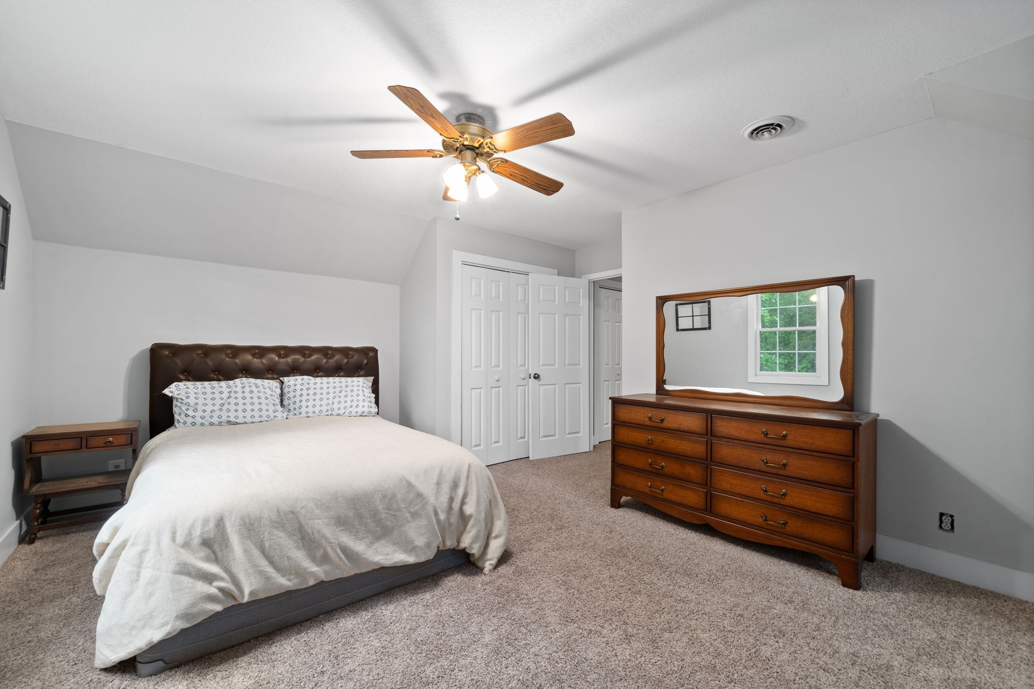 1925 7 Mile Ferry Road Clarksville, TN 37040 - Photo 36 of 57 a bedroom with a bed and a chandelier