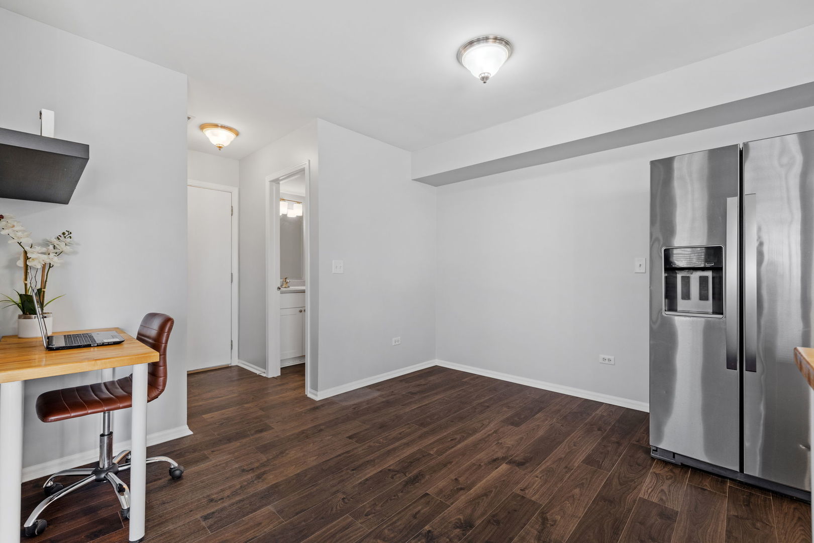 25172 Faraday Road, Unit 1 Manhattan, IL 60442 - Photo 11 of 25 a view of a room with wooden floor and furniture
