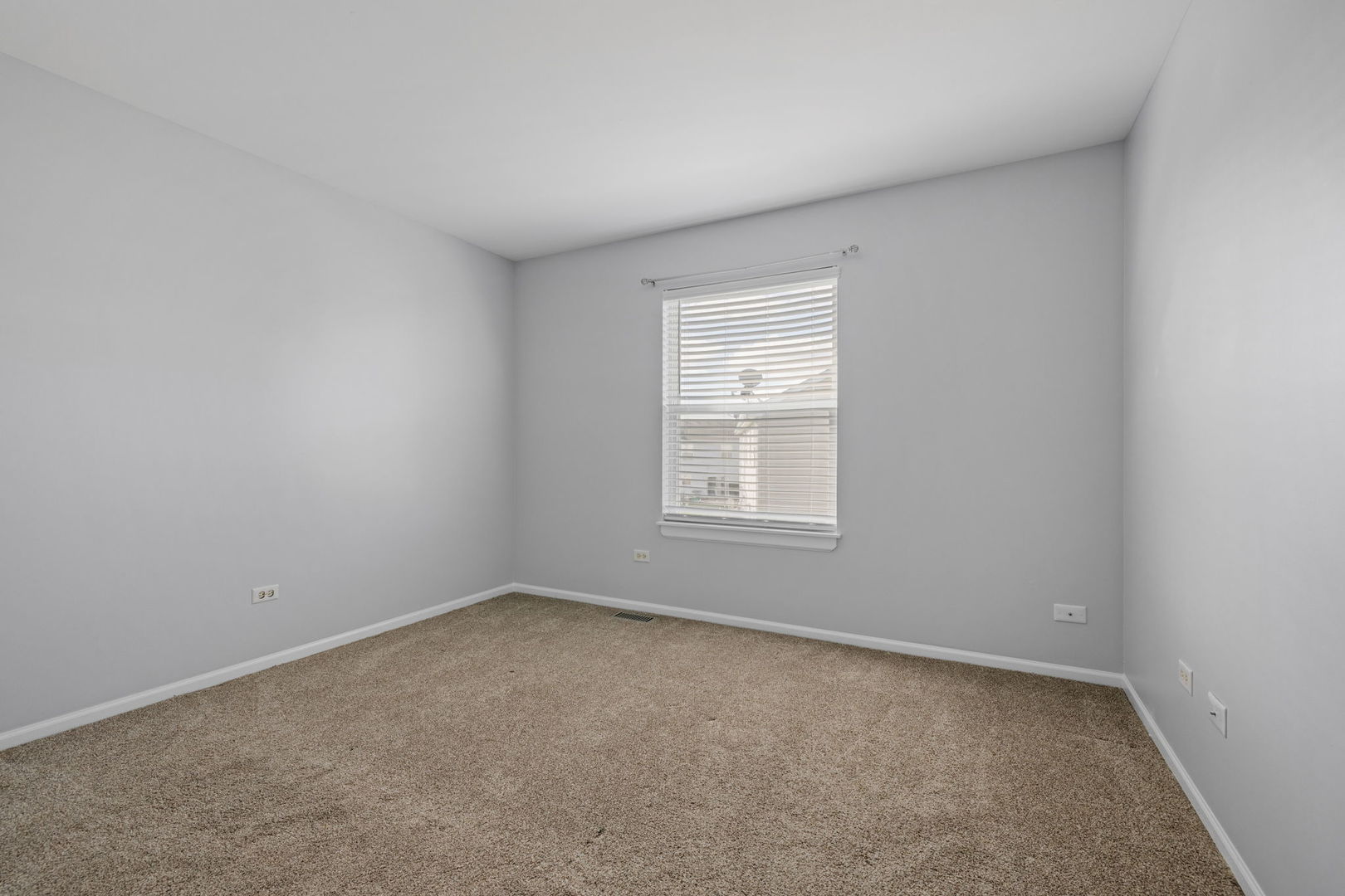 25172 Faraday Road, Unit 1 Manhattan, IL 60442 - Photo 18 of 25 an empty room with a window
