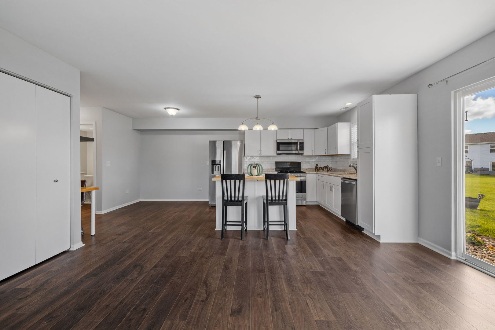 25172 Faraday Road, Unit 1 Manhattan, IL 60442 - Photo 8 of 25 a view of kitchen with wooden floor and electronic appliances