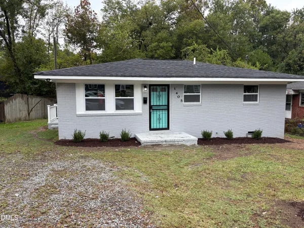 a front view of a house with yard