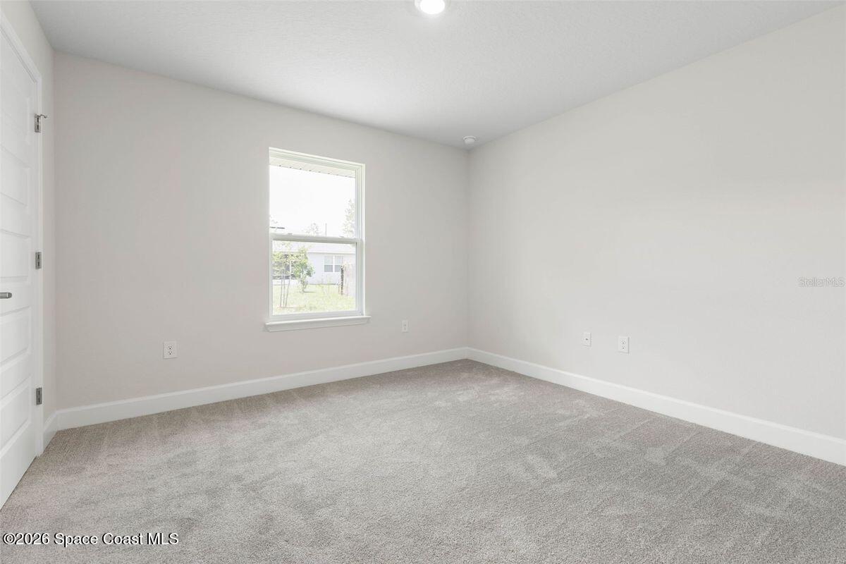962 Seneca Avenue Sebastian, FL 32958 - Photo 16 of 28 a view of an empty room with a window